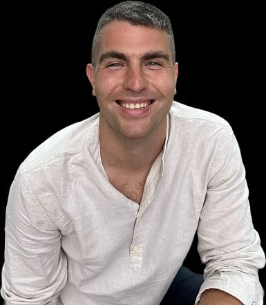 Dejan Zonjić smiling, in a white linen shirt
