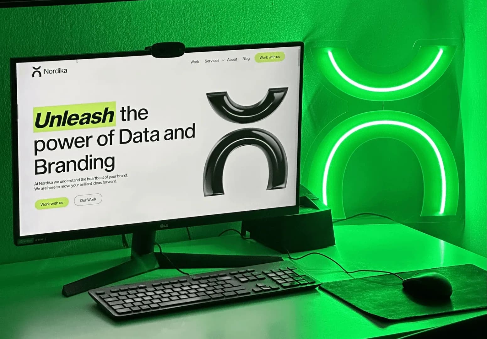 Nordika website on a monitor lit in green